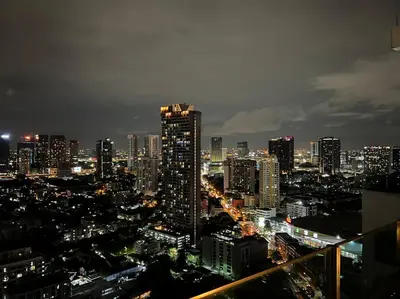 a city skyline at night with a tall building at HIGH RISE LUXURY CONDO 1BED ROOF TOP POOL 2 MinMRT in Bangkok
