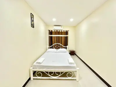 a white room with a bed in it at Baan at Khaosan Hostel in Bangkok