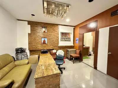 a living room with a couch and a table at Baan at Khaosan Hostel in Bangkok