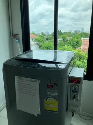 a machine sitting in front of a window at 2 mins walk to BTS Bang Chak in Bangkok