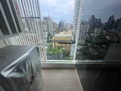 a large window in a building with a view of a city at 2 Bedroom Luxury Apartment 3 min walk from BTS Ekkamai in Bangkok