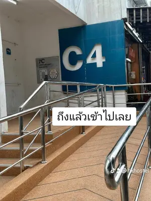 a sign for a store in a shopping mall at NK hostel in Thung Si Kan