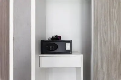 a radio sitting on top of a white table at Dazzle Sukhumvit 7 by LeFoyer in Bangkok