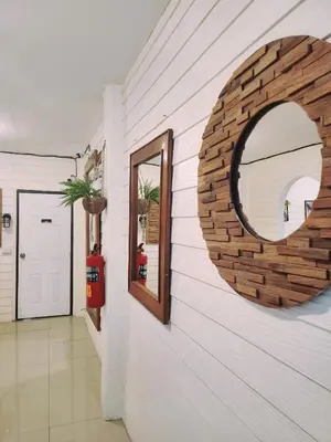 a mirror on the wall of a hallway at Back Home Backpackers Hostel in Bangkok