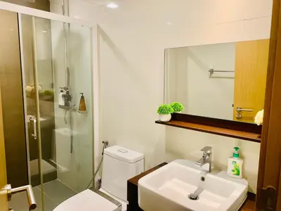 a bathroom with a sink and a shower and a toilet at interLux Premier Sukumvit , Nana , Bangkok in Bangkok