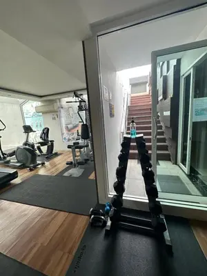 a room with a gym with a person on a treadmill at interLux Premier Sukumvit , Nana , Bangkok in Bangkok