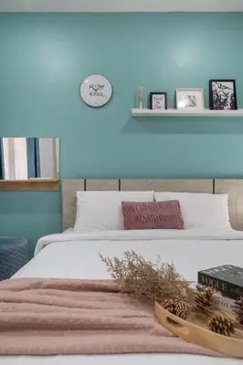 a bedroom with two beds and a blue wall at Spacious Haven Chatuchak Market 5BR 10 Sleeps RB1 in Ban Zong Katiam
