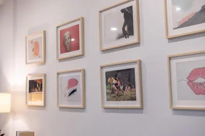 a bunch of pictures on a white wall at Spacious Haven Chatuchak Market 5BR 10 Sleeps RB1 in Ban Zong Katiam