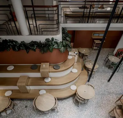 an overhead view of a restaurant with tables and chairs at Double B Hostel in Bangkok