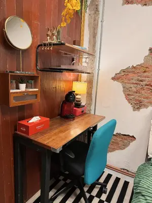 a desk with a blue chair in a room at New York Loft & Japanese Magic by V4SKIN in Bangkok