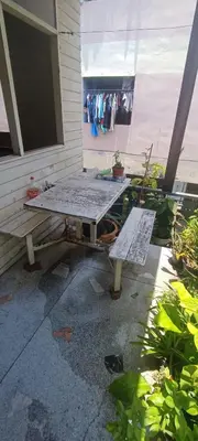 a picnic table sitting outside of a house at 206 Lovely Room with cool fan with full amenities & Free Wi-Fi in Bangkok