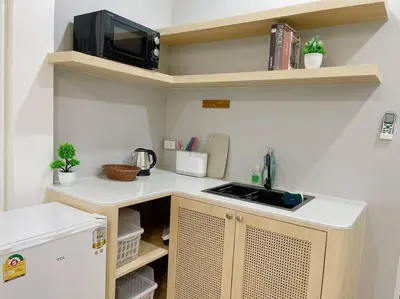 a kitchen with a counter top with a microwave at Unwind in oldtown, private floor, near Grand Palace in Bangkok
