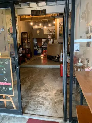 a view of the dining room from the inside of a restaurant at Enterspace Chinatown in Khlong San