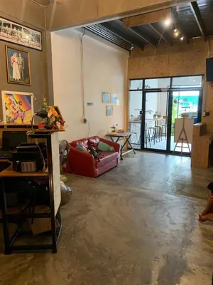 a living room with a couch and a table at Enterspace Chinatown in Khlong San