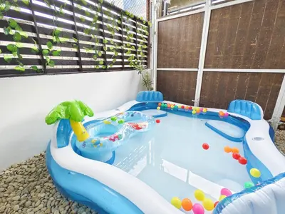 a hot tub in the corner of a backyard at Ratchada Retreat Villa 2 in Bangkok
