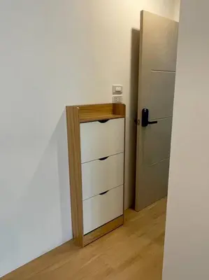 a kitchen with a dresser and a refrigerator at 33 Avenue in Bangkok