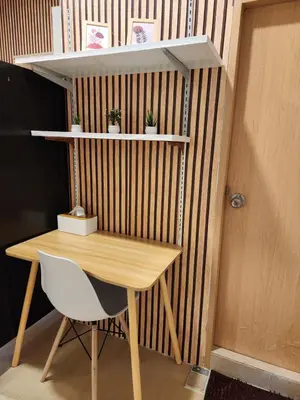 a desk with a chair and a table and shelves at 205-Olan Place Homely room Free Wi-Fi and Near BTS line in Ban Yang