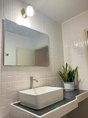 a white bathroom with a sink and a mirror at T12 Popular Condo By : hunnity in Ban Bang Phang