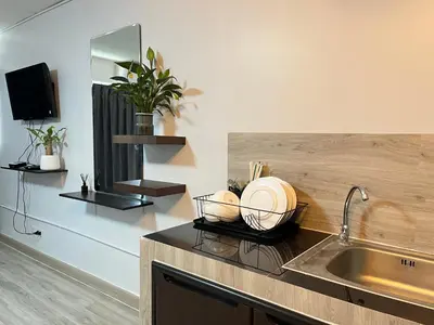a kitchen with a sink and a counter top at T12 Popular Condo By : hunnity in Ban Bang Phang