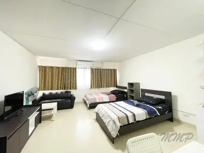 a bedroom with two beds and a desk and a couch at Popular The best muangthongthani \u65e5\u5e38\u623f\u95f4\u516c\u5bd3 in Ban Bang Phang