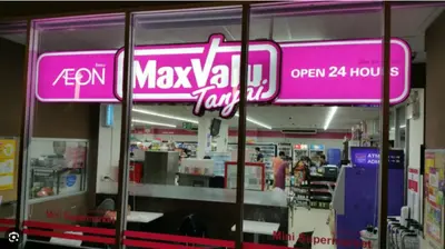 a store with a pink sign on the window at Elio Del Ray condo feel resort in Bangkok