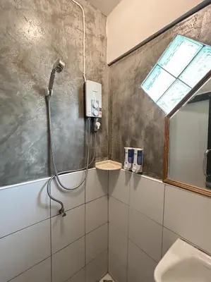 a bathroom with a shower and a sink at T-house Bkk - Max15 people with private swimming pool in Bangkok