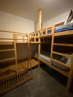 a room with two bunk beds in a room at T-house Bkk - Max15 people with private swimming pool in Bangkok