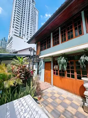 a building in a city with tall buildings at T-house Bkk - Max15 people with private swimming pool in Bangkok