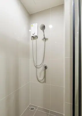 a shower with a shower head in a bathroom at Bangkok city center-thong lo-rca-high-rise one-bedroom in Bangkok
