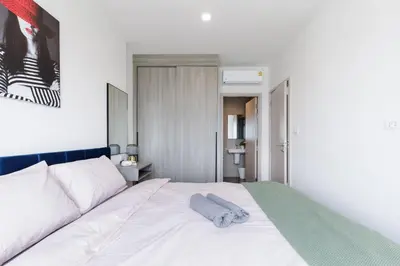 a bedroom with a bed with a towel on it at 2 bedrooms -1 living room and 1 bathroom - swimming pool in Ban Rang Sai (2)