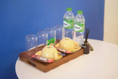 a table with a tray with bottles of water at SANT Bangkok at Khaosan Road in Bangkok