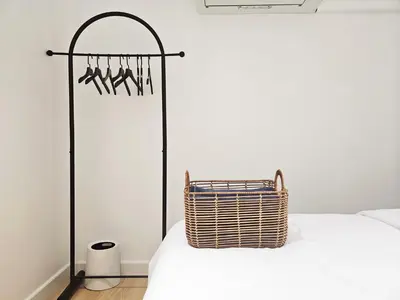 a room with a bed with a basket on it at PB home 1 min to BTS Saladaeng & MRT Silom in Bang Rak