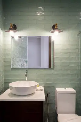 a bathroom with a sink and a toilet and lights at Homie Non - โฮมมี่ นนท์ in Ban Bang Khwang