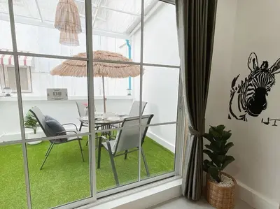 a dining room with a table with a zebra on the wall at Relax Private terrace&cozy BR,near Grand palace in Bangkok