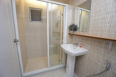 a bathroom with a shower and a sink at Maruay Living Apartment 509 (Khaosan/Chinatown/Samyot MRT) in Bangkok