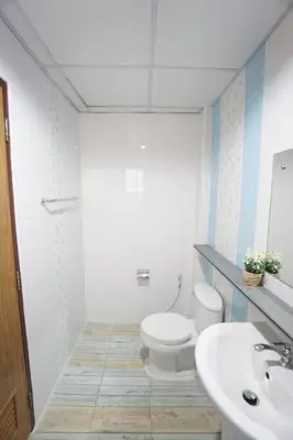 a bathroom with a toilet and a sink at Maruay Living Apartment 506 (Khaosan/Chinatown/Samyot MRT) in Bangkok