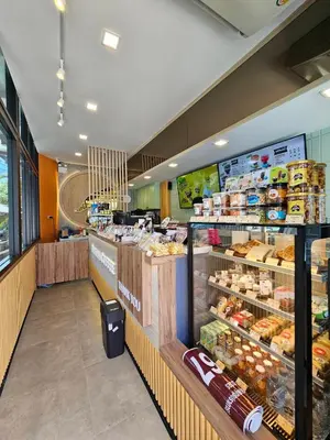 a grocery store aisle with a display of food at Irich residence South Samrong 6 Kms BTS-Pu Chao in Samut Prakan
