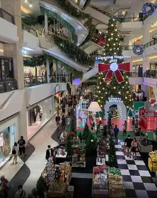 a shopping mall with a christmas tree in the middle at The Parkland Condominium in Bangkok