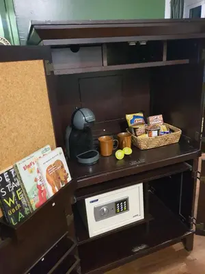a table with a microwave and some food on it at Motu Bangkok in Bangkok