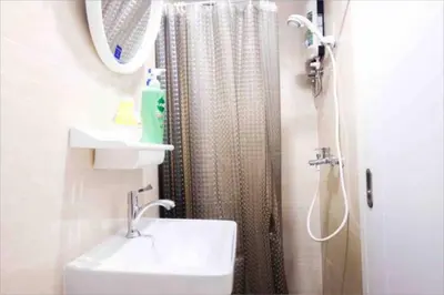a bathroom with a sink and a shower at Spacious 4BRTownhouse BTS Onnut 10 Sleeps with Parking in Amphoe Phra Khanong