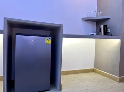 a stainless steel refrigerator in a counter in a kitchen at DiscoveryHome3 at Pratunammarket in Bangkok