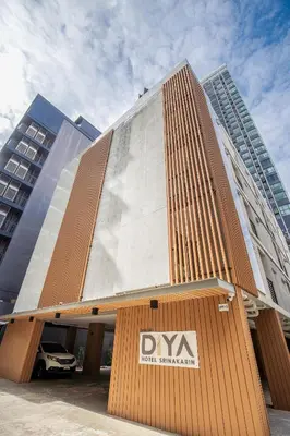 a building with a sign in front of it at Diya Hotel Bangkok in Amphoe Phra Khanong