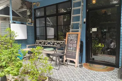 a restaurant with a sign in front of a building at El Biografo in Bangkok
