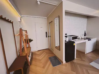 a small room with a refrigerator and a counter at Better Room ห้องพักรายวัน เมืองทองธานี C5 in Nonthaburi
