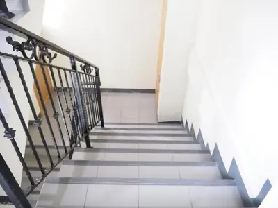 a staircase in a building with a stair railing at NANA BEST INN HOTEL in Makkasan