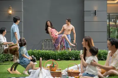 a group of people sitting in a yard at Pranakorn Heritage Hotel in Bangkok