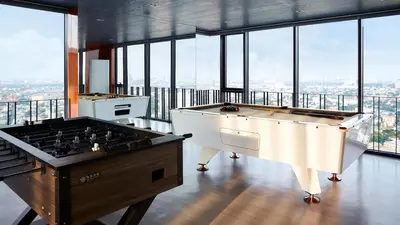 two pool tables in a room with windows at N Condominium in Ban Bang Khen (1)