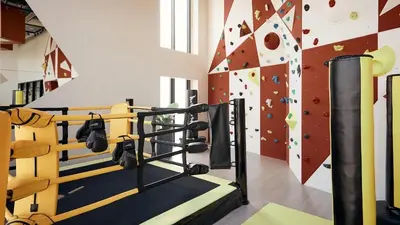 a gym with a rock climbing wall at N Condominium in Ban Bang Khen (1)