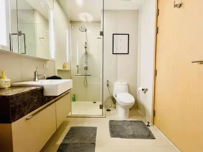 a bathroom with a toilet and a sink and a shower at 2BedRoom-BestLocationBangkok-Emquartier-Metro-PhromPhong in Bangkok