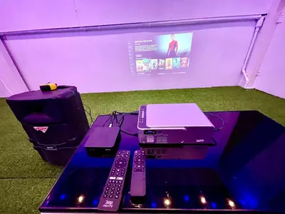 a printer and two remote controls sitting on a table at k4 be chill *Wongwianyai BTS_80m*Family&Friend* in Godown